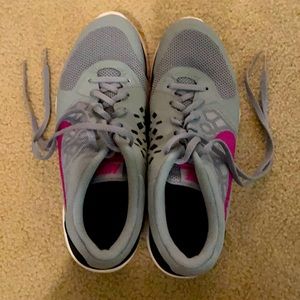 Nike sport shoes. Gray w/ pink and purple swoosh.